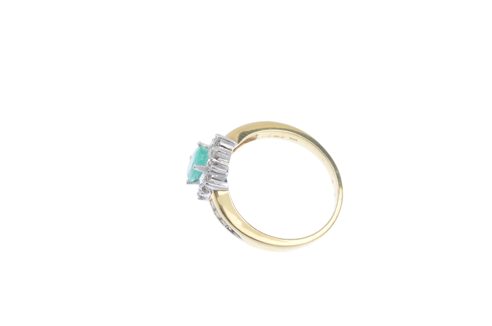 * An 18ct gold emerald and diamond cluster ring. The oval-shape emerald, within a brilliant-cut - Image 3 of 4