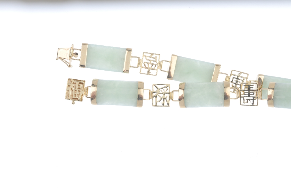 A 9ct gold jade bracelet. Designed as a series of rectangular jadeite panels, with oriental openwork - Image 3 of 3
