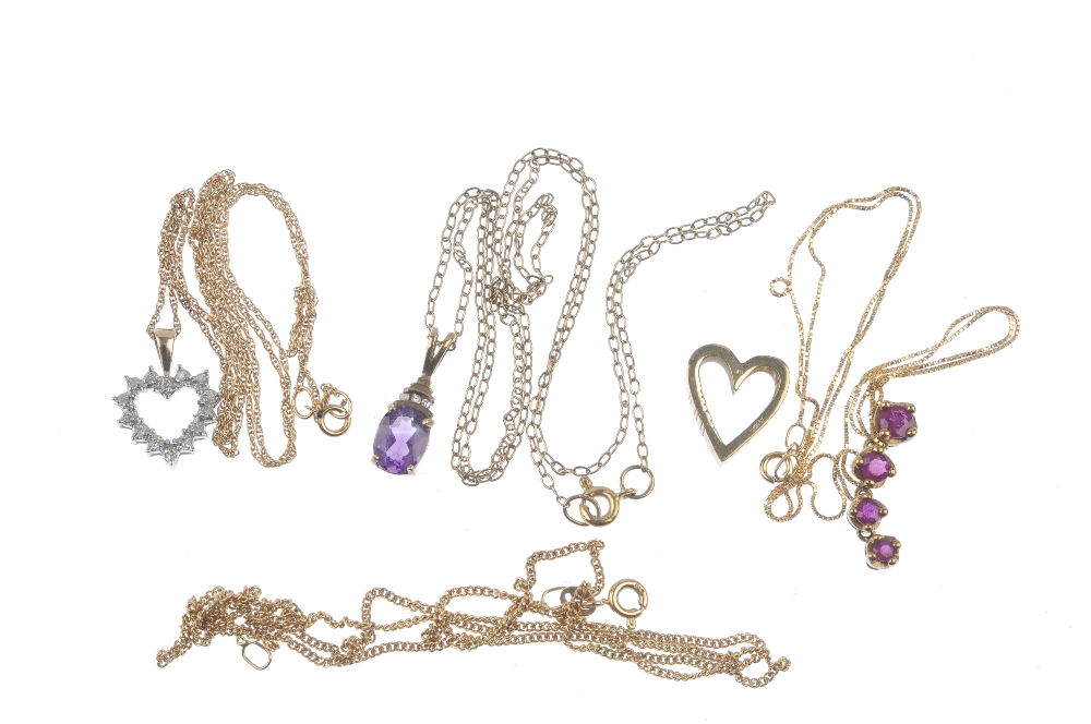 A selection of four pendants. To include an amethyst and diamond pendant, suspended from a 9ct - Image 2 of 2