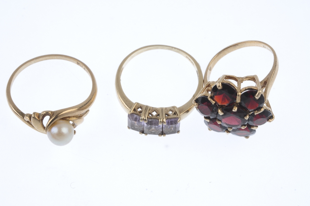 A selection of three 9ct gold gem-set rings. To include a garnet cluster ring, an amethyst three- - Image 2 of 3