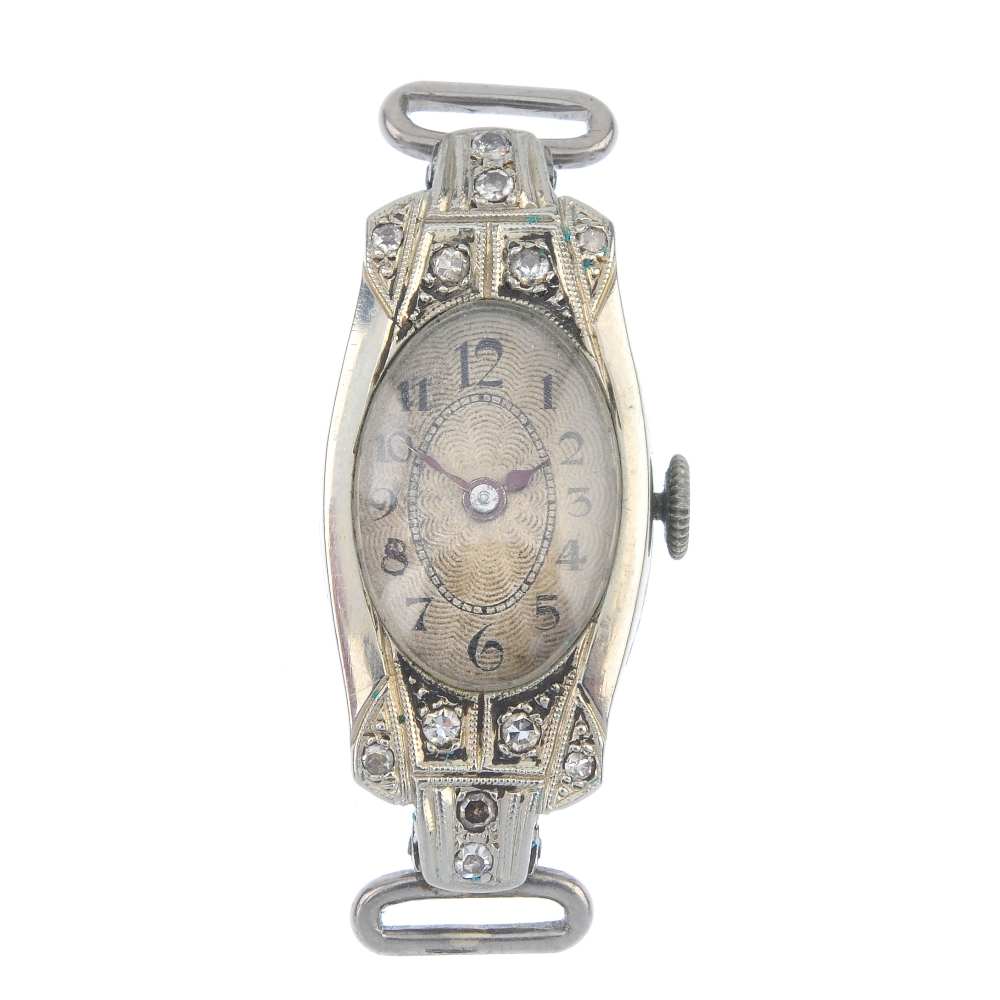 An early 20th century 18ct gold cocktail watch head. The oval-shape cream dial, with black Arabic