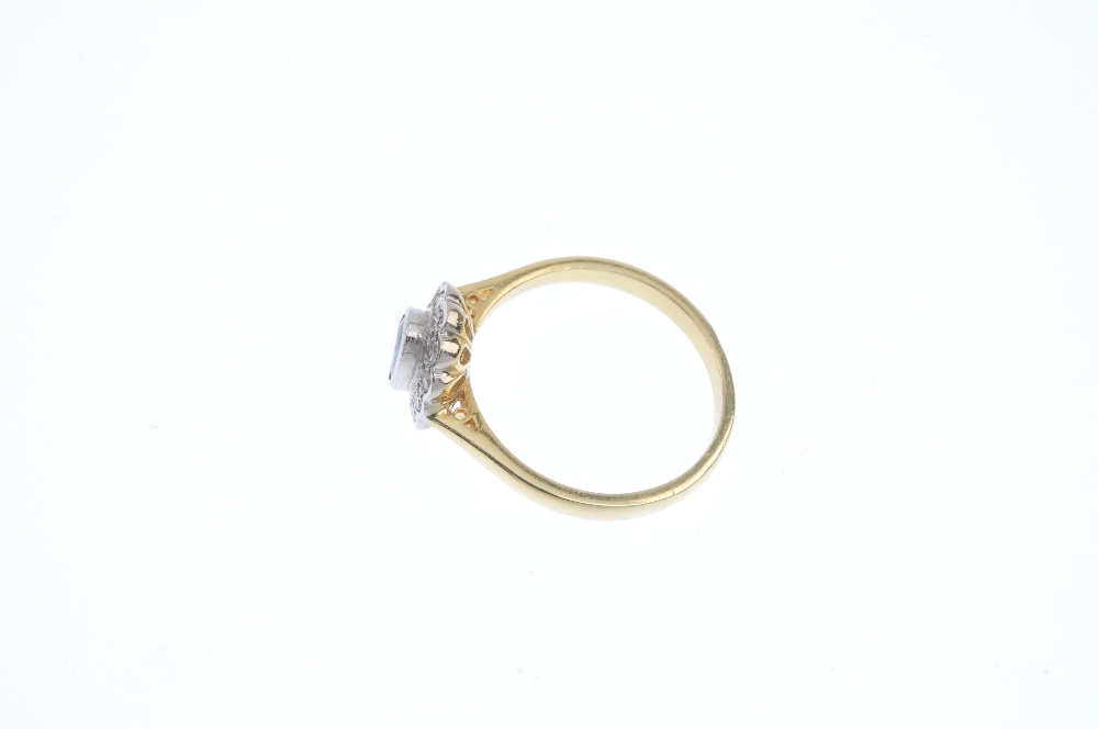 An 18ct gold sapphire and diamond cluster ring. The oval-shape sapphire collet, within a brilliant- - Image 3 of 4