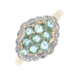 A 9ct gold emerald and diamond cluster ring. The circular-shape emerald lozenge-shape cluster,