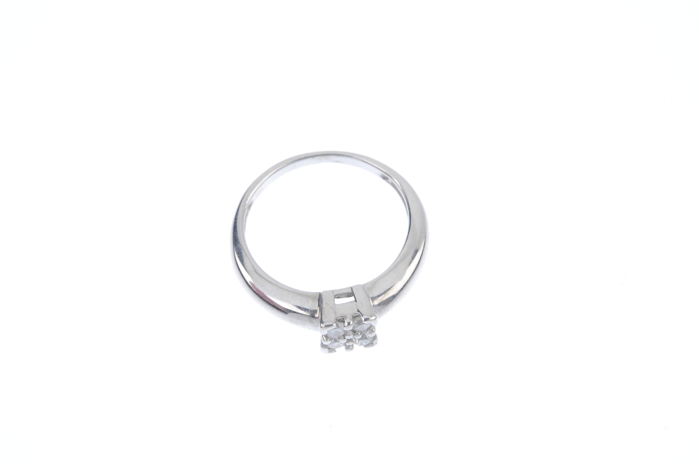 A diamond ring. The brilliant-cut diamond, within a similarly-cut diamond quatrefoil, to the tapered - Image 2 of 4