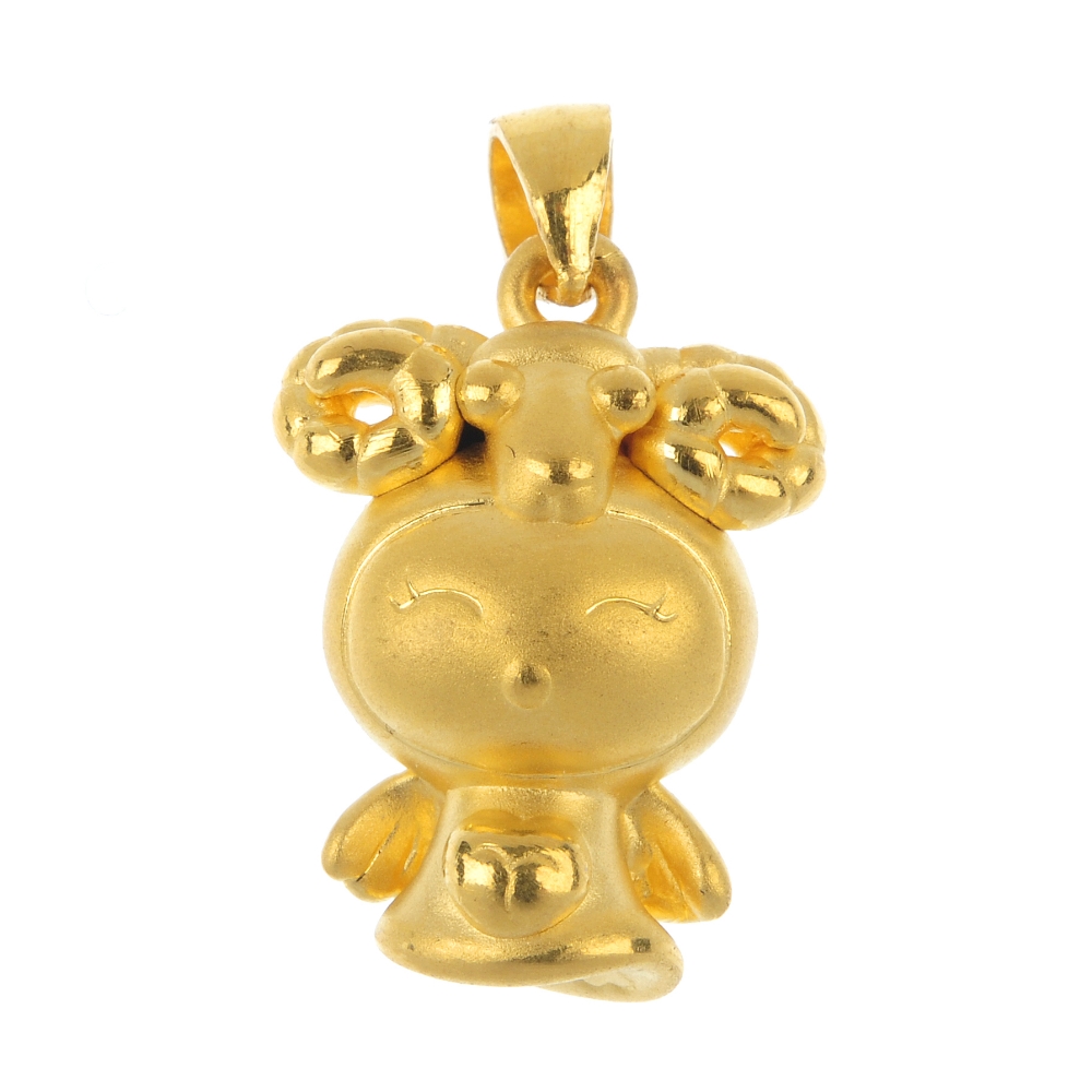 A novelty pendant. Designed as a stylised smiling angel, with heart detail and ram skull