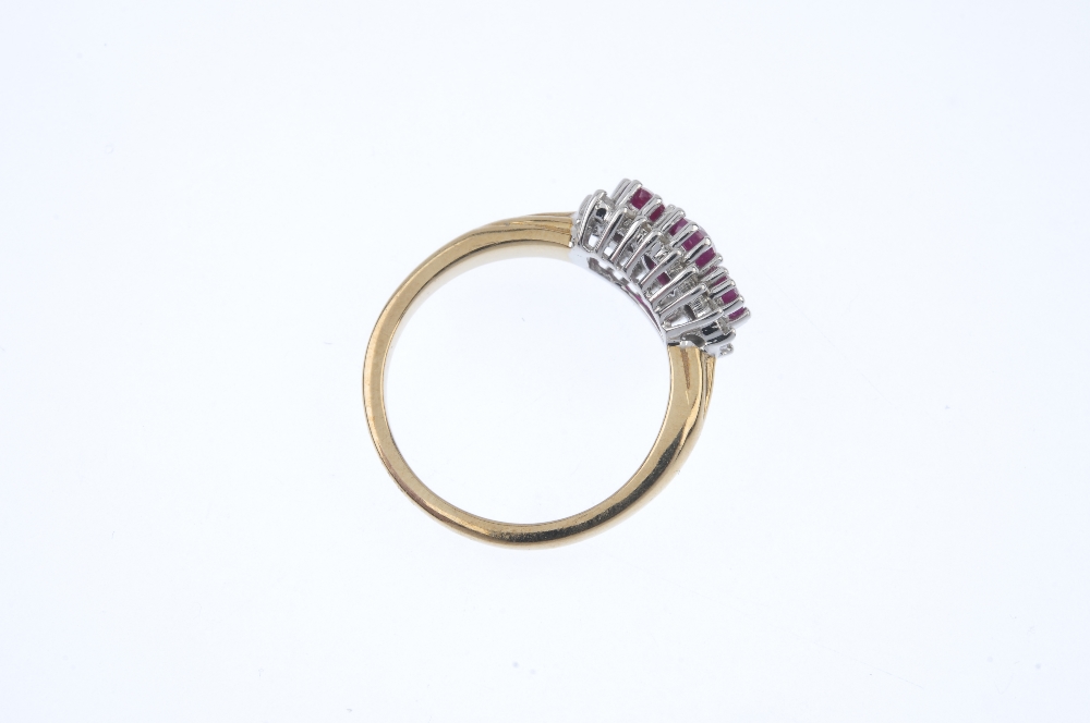 A 9ct gold ruby three-stone and diamond cluster ring. The slightly graduated oval-shape ruby line, - Image 4 of 4