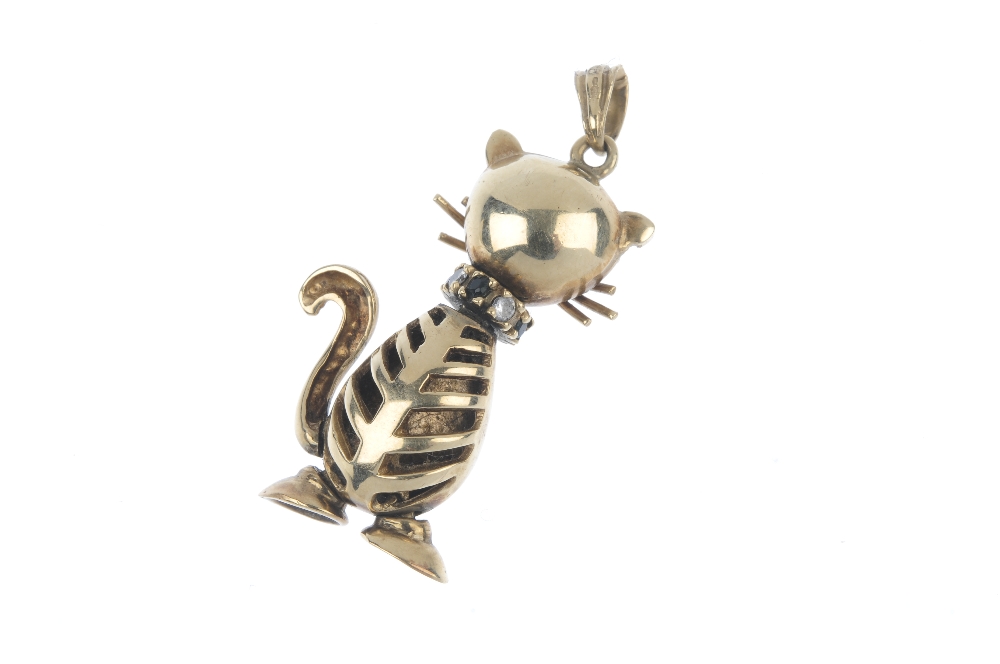 A 9ct gold gem-set novelty pendant. Designed as a cat, with synthetic sapphire eyes and vari-gem - Image 2 of 2