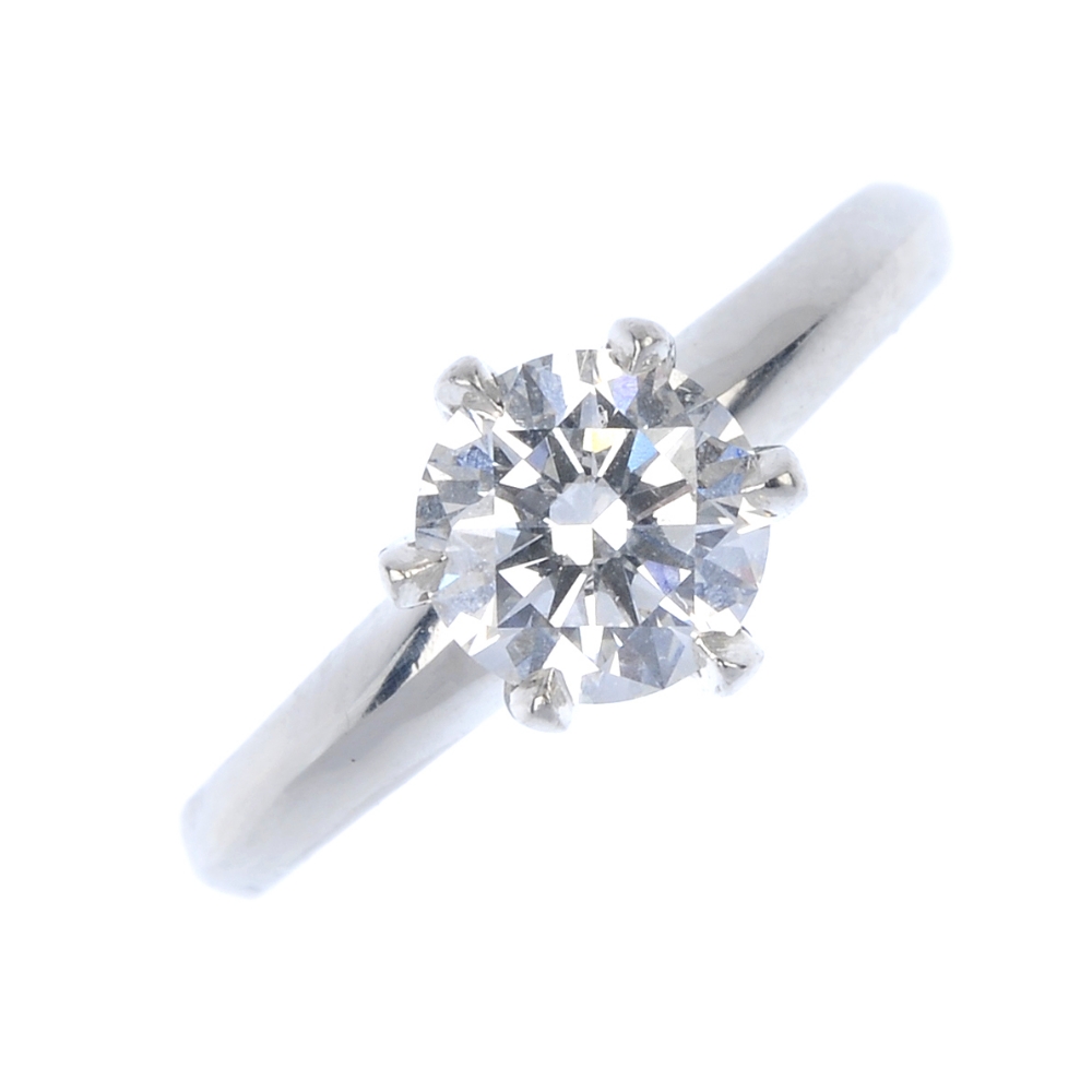 A diamond single-stone ring. The brilliant-cut diamond, weighing 0.70ct, to the tapered band.