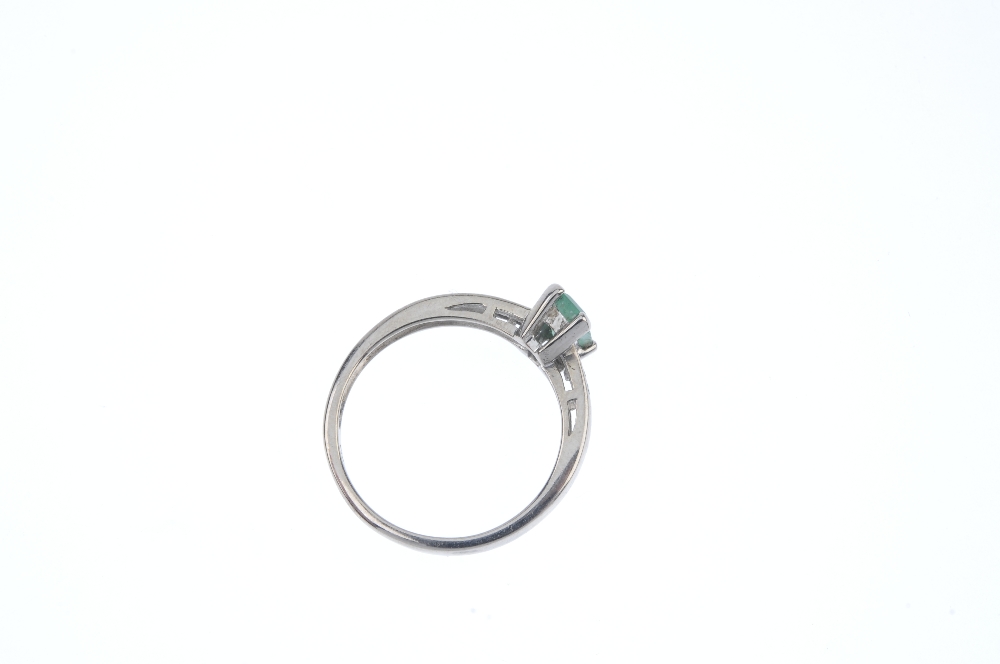 An 18ct gold emerald and diamond dress ring. The rectangular-shape emerald, to the single-cut - Image 4 of 4