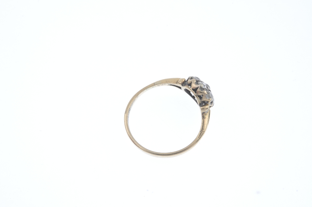 An early 20th century gold diamond cluster ring. The old-cut diamond, within a similarly-cut diamond - Image 4 of 4