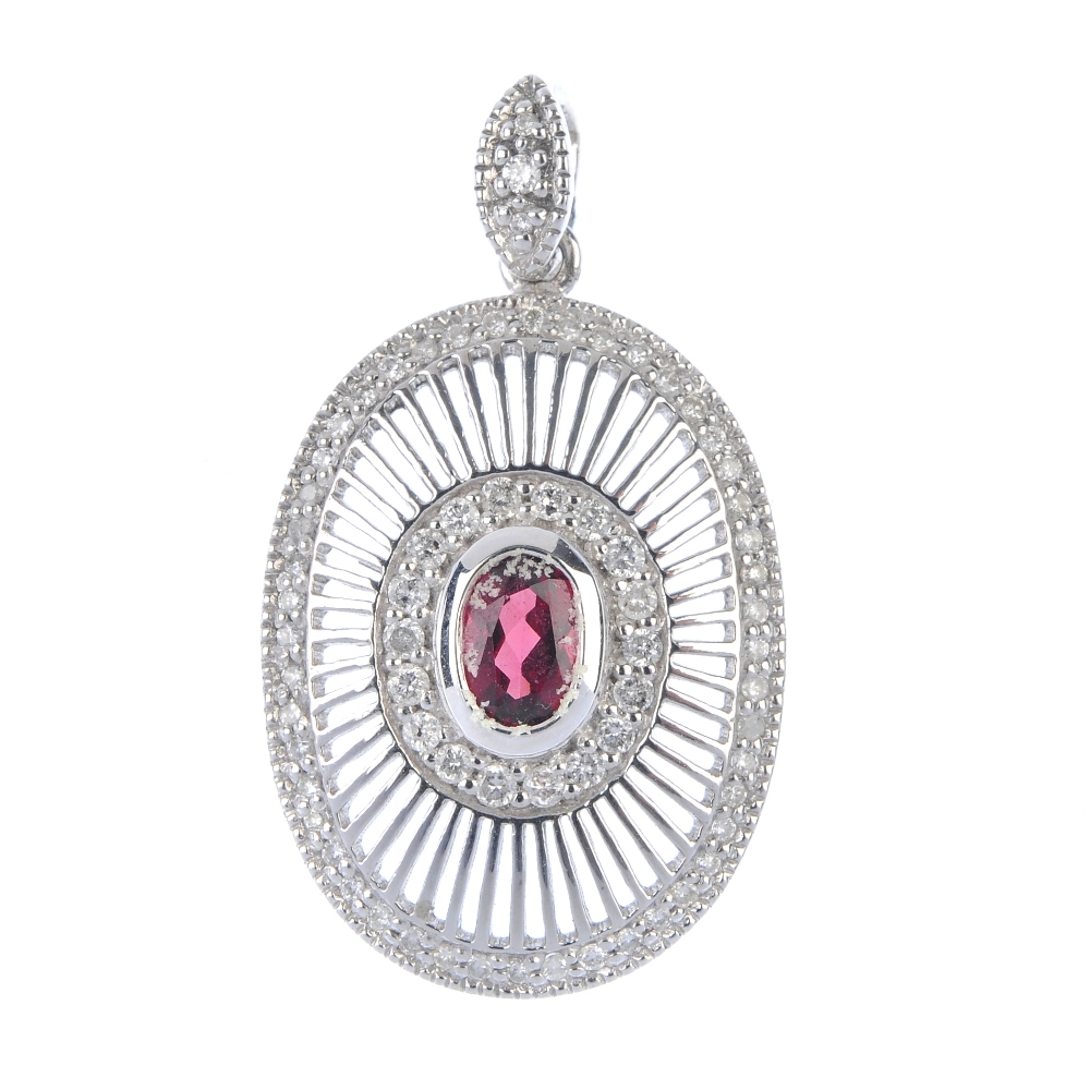 An 18ct gold garnet and diamond pendant. The oval-shape garnet collet, within a brilliant-cut