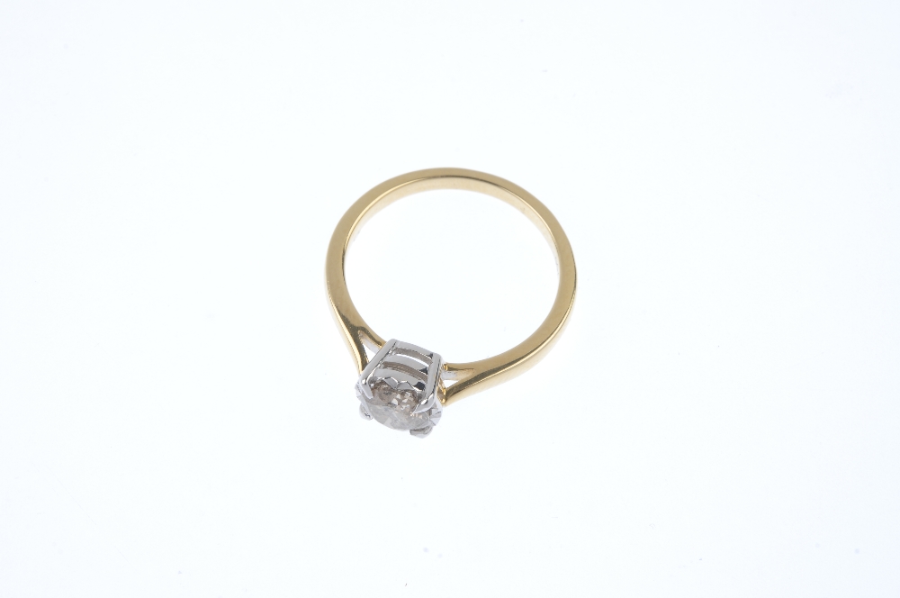 A diamond single-stone ring. The brilliant-cut diamond, to the tapered shoulders and plain band. - Image 2 of 4