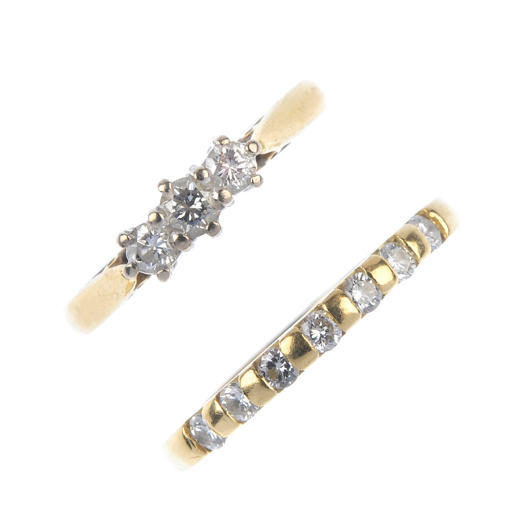 Two 18ct gold diamond dress rings. To include a brilliant-cut diamond three-stone ring and a