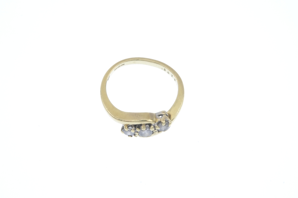 An 18ct gold diamond crossover ring. The graduated brilliant-cut diamond line, to the asymmetric - Image 2 of 4