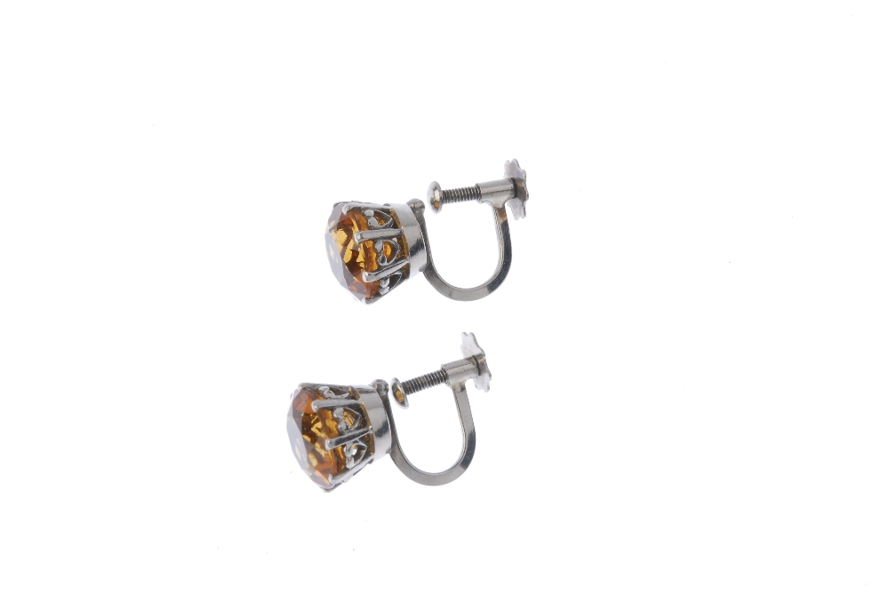 A pair of citrine ear studs. Each designed as a circular-shape citrine, to the screw back fitting. - Image 2 of 2