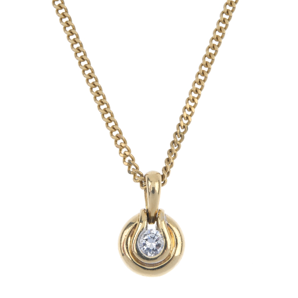 A gold diamond pendant. The brilliant-cut diamond, within a grooved surround, suspended from a 9ct