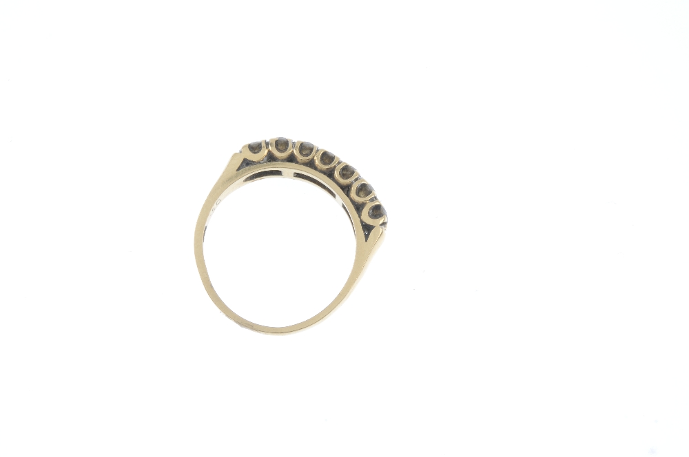 An 18ct gold diamond seven-stone ring. The brilliant-cut diamond line, to the tapered band. Total - Image 4 of 4