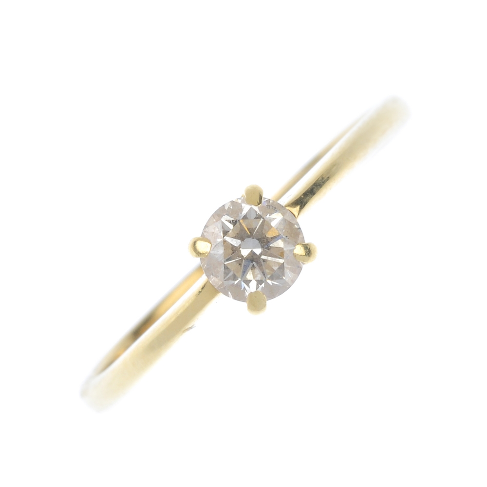 An 18ct gold diamond single-stone ring. The brilliant-cut diamond, to the tapered band. Diamond