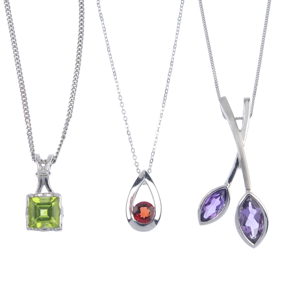 A selection of three gem-set pendants. To include a 9ct gold square-shape peridot pendant, a 9ct