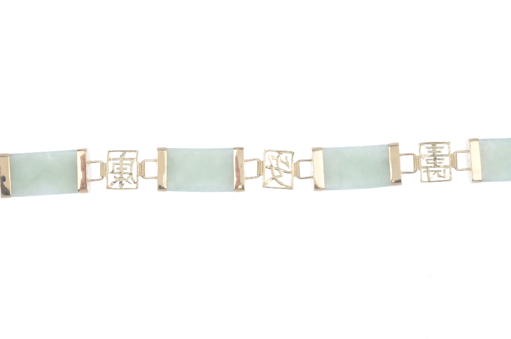 A 9ct gold jade bracelet. Designed as a series of rectangular jadeite panels, with oriental openwork - Image 2 of 3