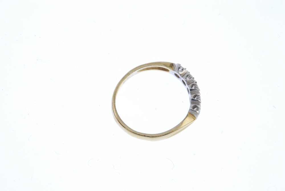 An 18ct gold diamond five-stone ring. The brilliant-cut diamond line, with bar spacers, to the - Image 4 of 4