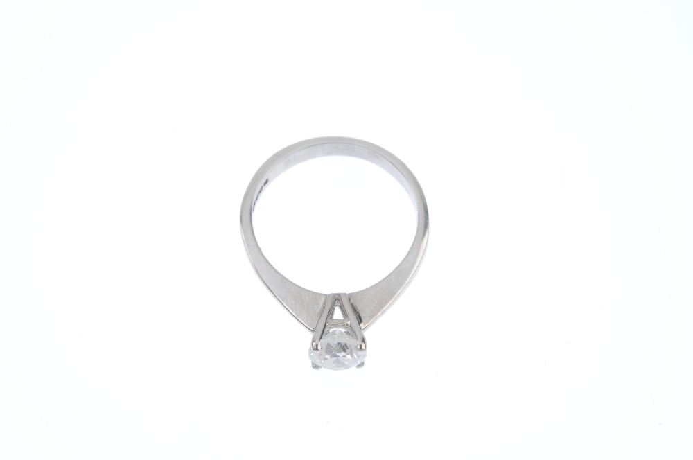 * An 18ct gold diamond single-stone ring. The brilliant-cut diamond, to the tapered shoulders and - Image 2 of 4