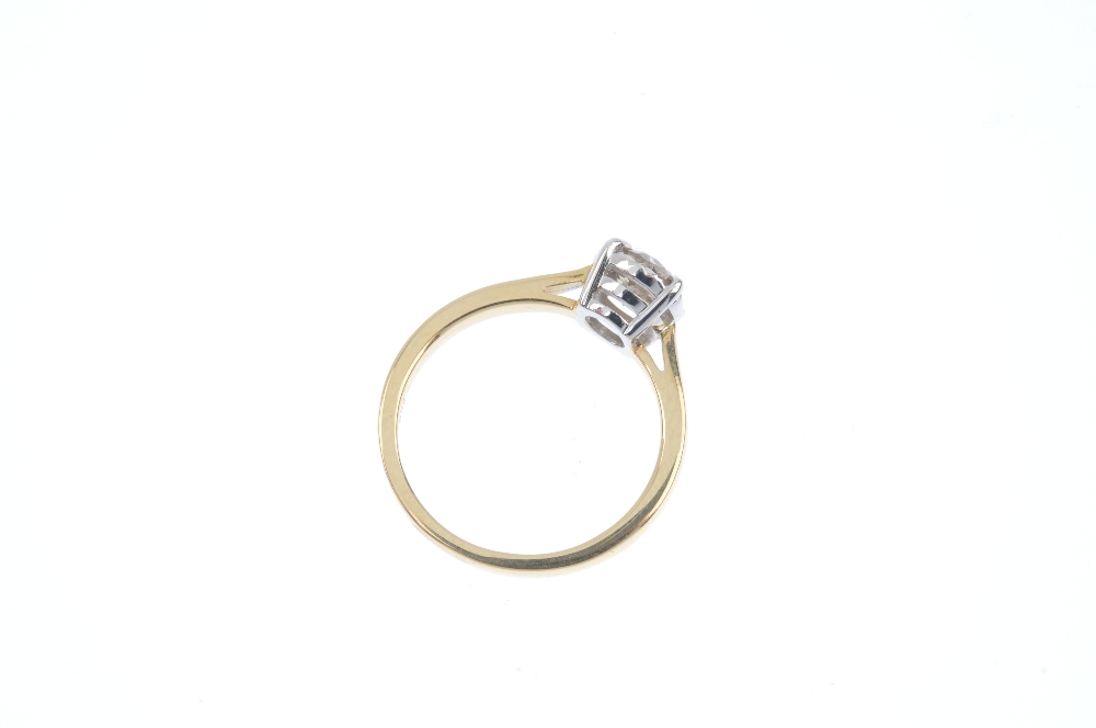 A diamond single-stone ring. The brilliant-cut diamond, to the tapered shoulders and plain band. - Image 4 of 4