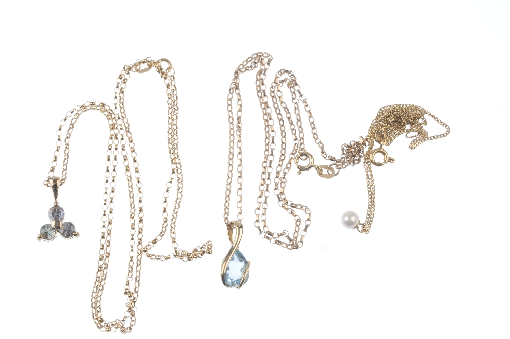 A selection of three pendants. To include a 9ct gold blue topaz pendant, suspended from a 9ct gold - Image 2 of 2