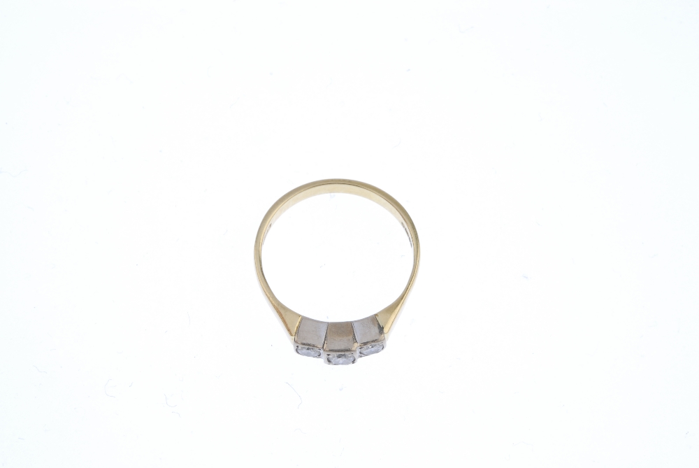 An 18ct gold diamond three-stone ring. The brilliant-cut diamond stepped line, to the tapered - Image 2 of 4