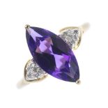 A 9ct gold amethyst and diamond dress ring. The marquise-shape amethyst, to the single-cut diamond