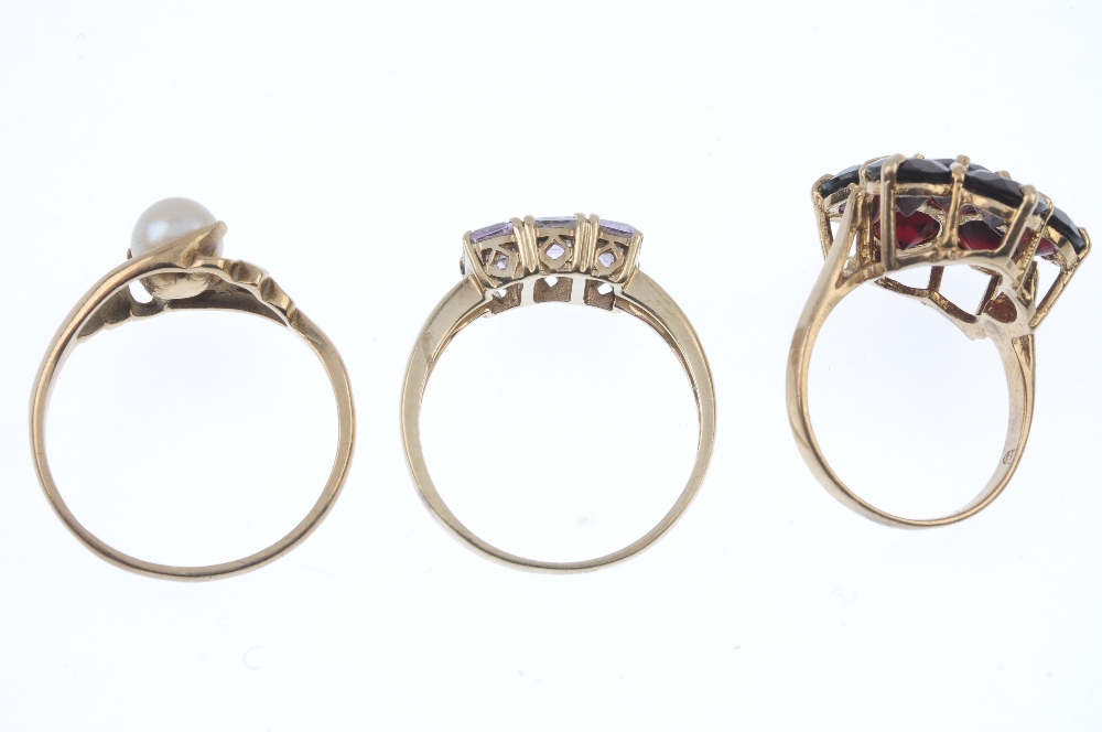 A selection of three 9ct gold gem-set rings. To include a garnet cluster ring, an amethyst three- - Image 3 of 3