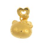 A 'Hello Kitty' pendant. The vari-texture 'hello kitty' head, with bow, suspended from similarly-