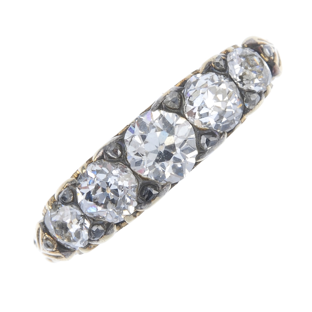 An early 20th century 18ct gold diamond five-stone ring. The graduated old-cut diamond line, with