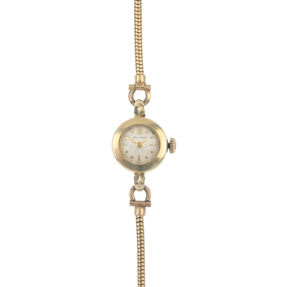 BULOVA - a lady's watch. The circular-shape cream dial with baton markers, to the 9ct gold snake-