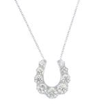 A diamond horseshoe pendant. The graduated brilliant-cut diamond horseshoe, suspended from an