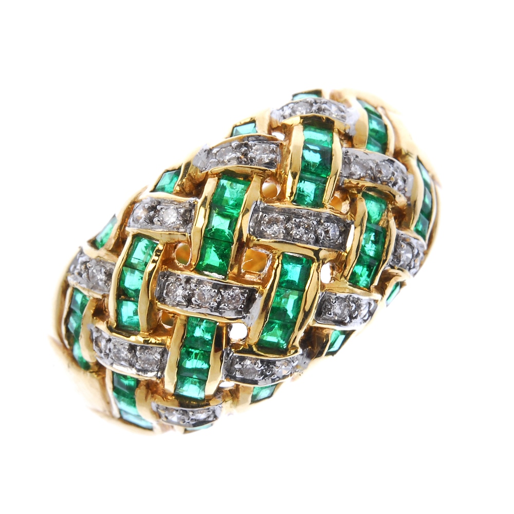 A diamond and emerald dress ring. Of openwork design, the square-shape emerald and brilliant-cut