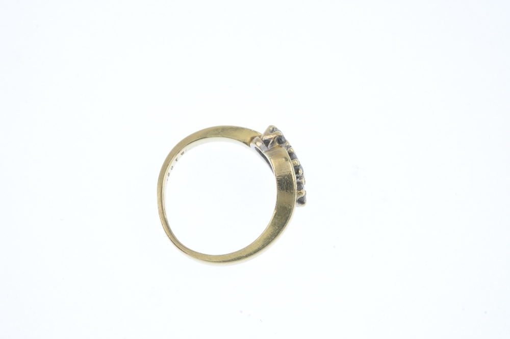 An 18ct gold diamond crossover ring. The graduated brilliant-cut diamond line, to the asymmetric - Image 4 of 4