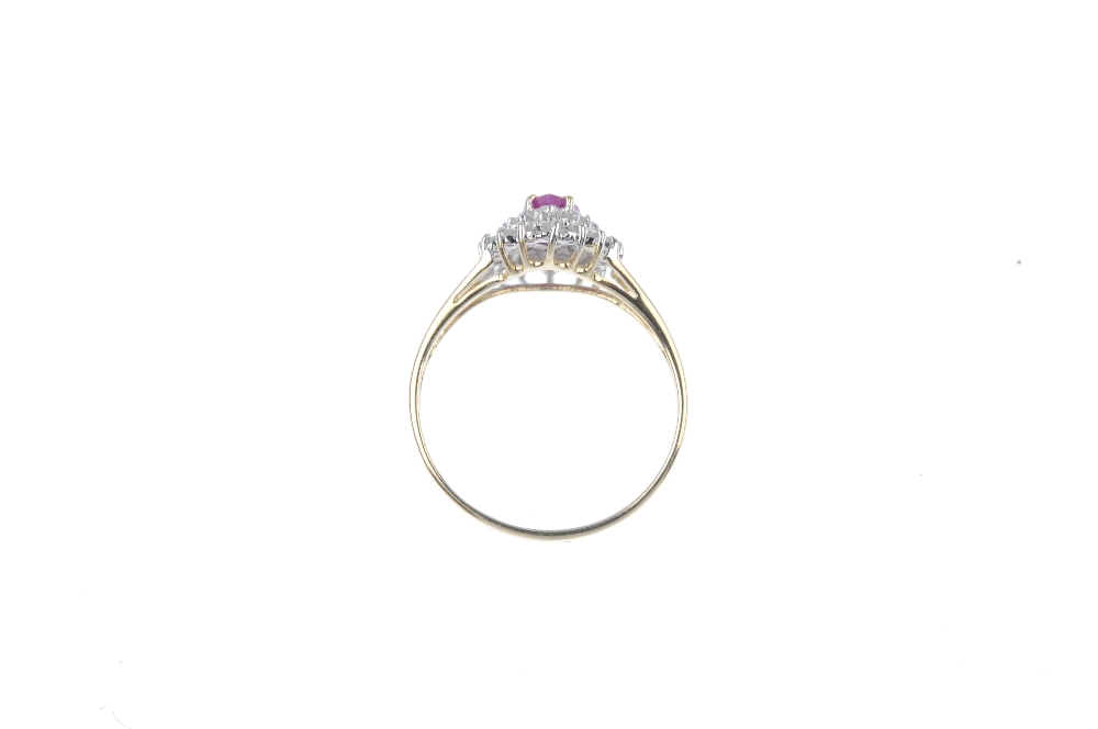 A 9ct gold ruby and diamond cluster ring. The pear-shape ruby, within a single-cut diamond double - Image 4 of 4