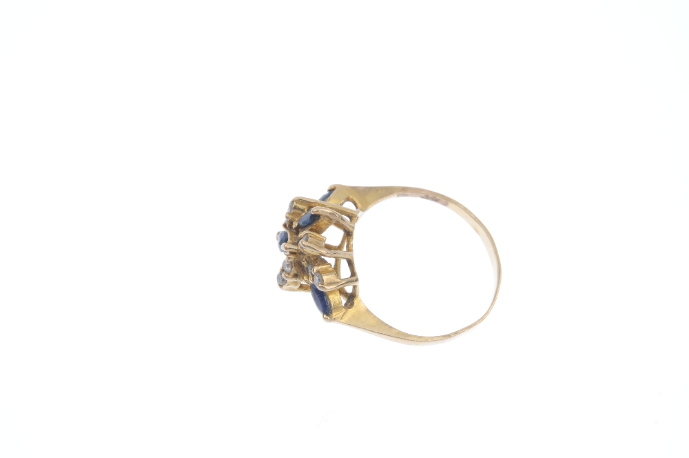 A diamond and sapphire dress ring. The marquise-shape sapphire and brilliant-cut diamond abstract - Image 3 of 4
