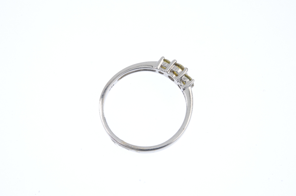 An 18ct gold colour treated diamond three-stone ring. The slightly graduated brilliant-cut ' - Image 4 of 4