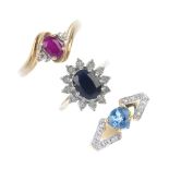 A selection of three 9ct gold gem-set rings. To include a sapphire and diamond cluster ring, a