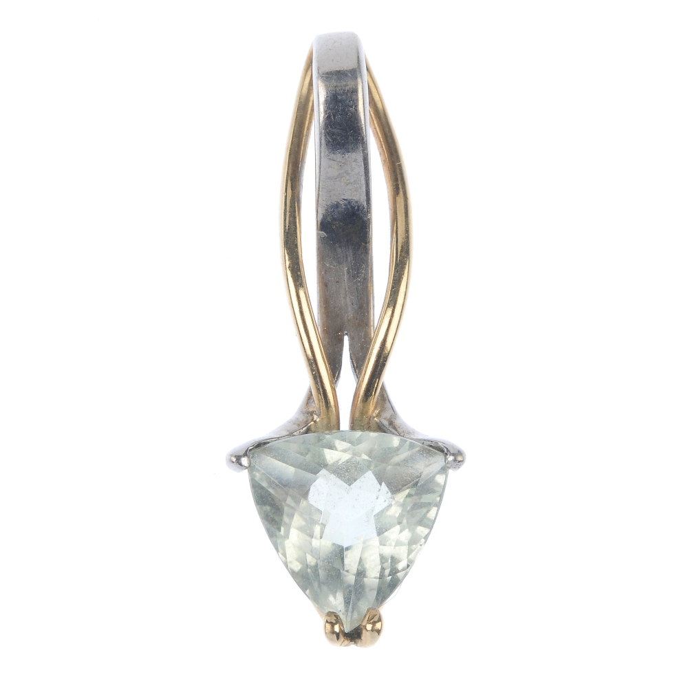 A praseolite pendant. The triangular-shape praseolite, with bi-colour, undulating surmount. Length