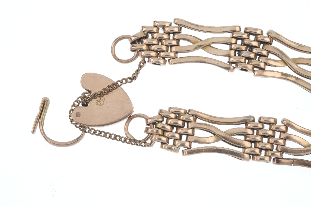 An early 20th century 9ct gold gate bracelet. Designed as a series of crossover bar gate-links, to - Image 2 of 2