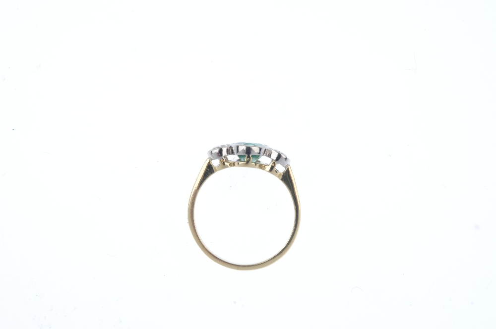 An emerald and diamond three-stone ring. The oval-shape emerald, with old-cut diamond shoulders. - Image 3 of 4