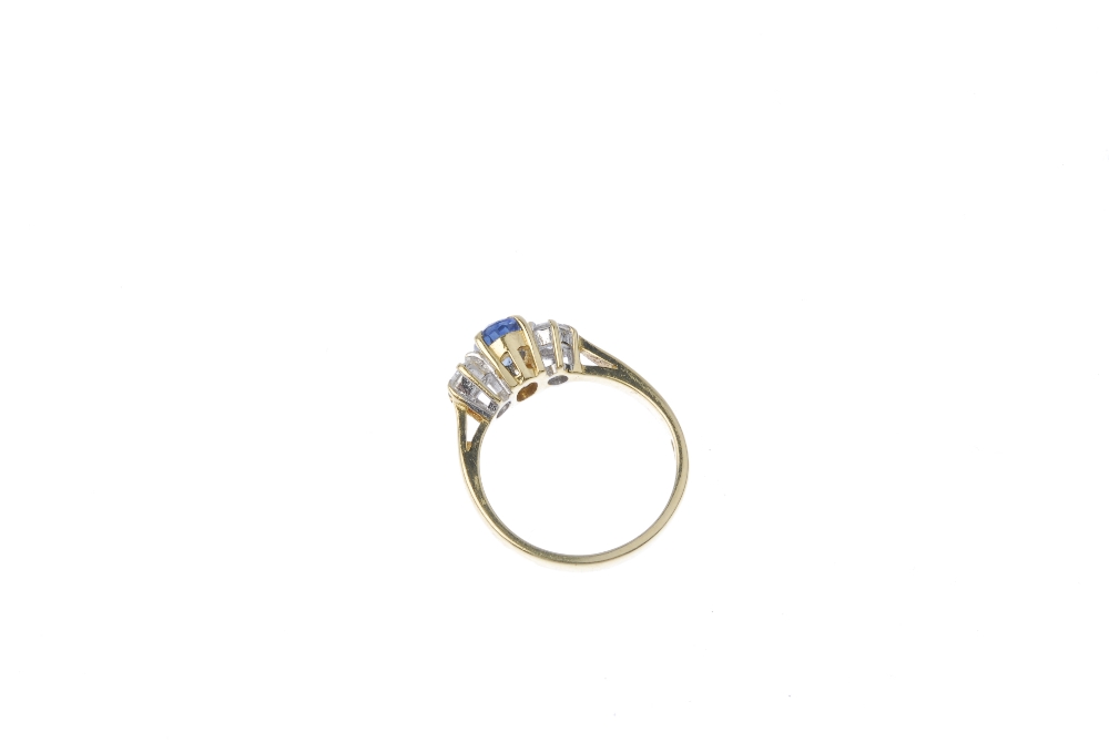 An 18ct gold sapphire and diamond three-stone ring. The oval-shape sapphire. between brilliant-cut - Image 4 of 4