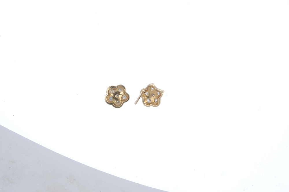 A pair of 9ct gold diamond cluster ear studs. Each designed as a brilliant-cut diamond, within a - Image 2 of 3