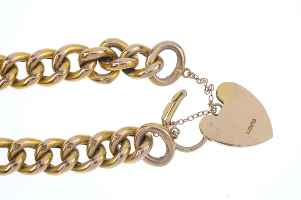 A late 19th century 9ct gold bracelet. The hollow curb-link chain, to the padlock clasp. Length - Image 2 of 2