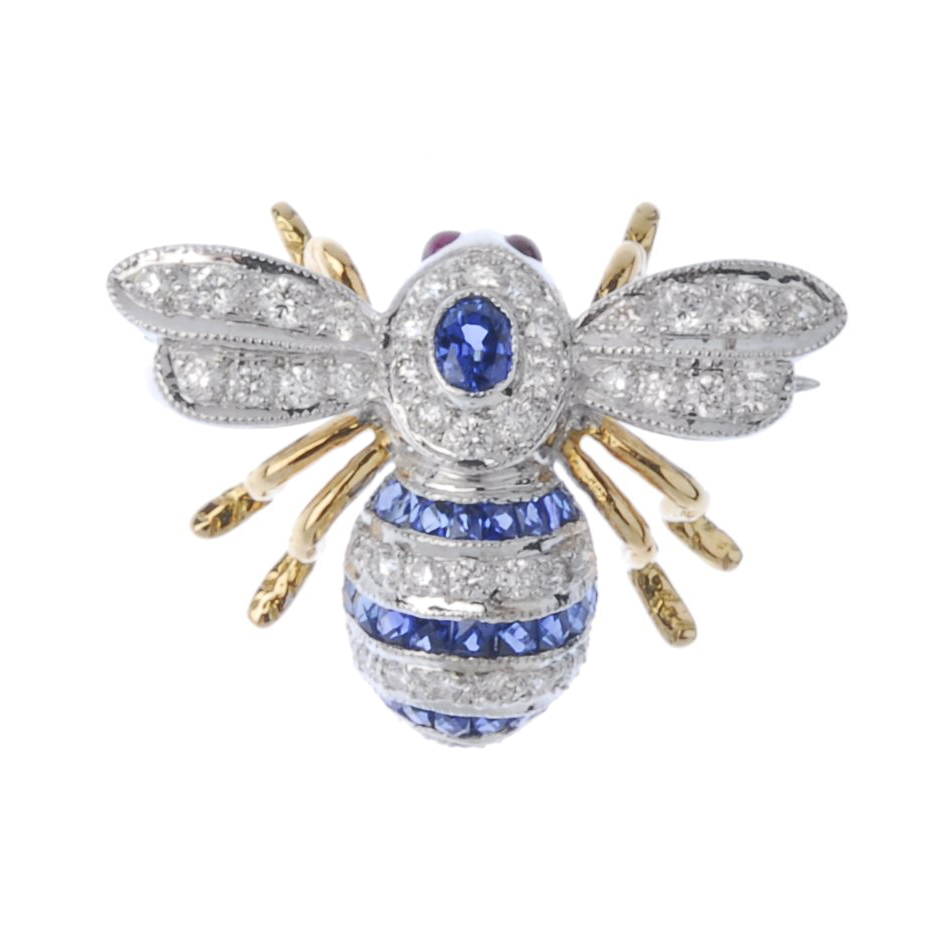 (193674) A diamond, sapphire and ruby bee brooch. The brilliant-cut diamond and calibre-cut sapphire