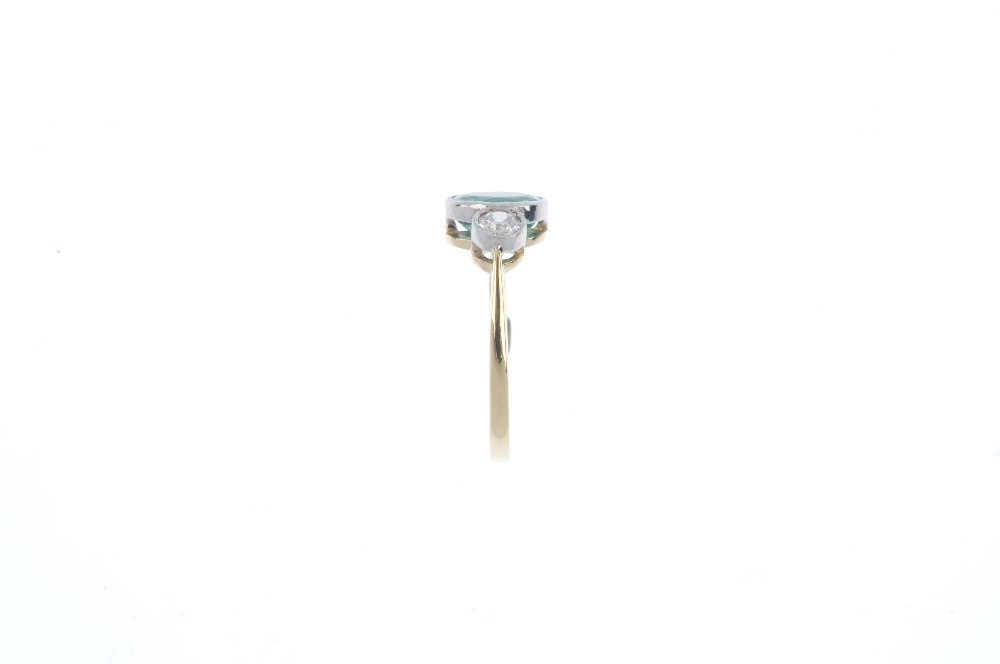An emerald and diamond three-stone ring. The oval-shape emerald, with old-cut diamond shoulders. - Image 2 of 4