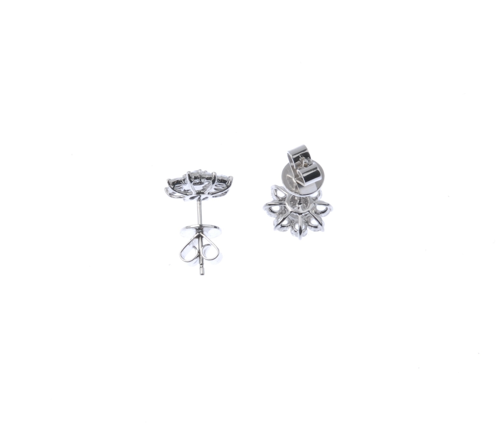 * A pair of diamond floral cluster ear studs. Each designed as a brilliant-cut diamond cluster, - Image 4 of 4
